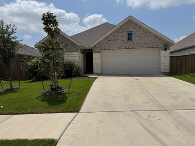 Ranch-style home featuring brick siding, a front 