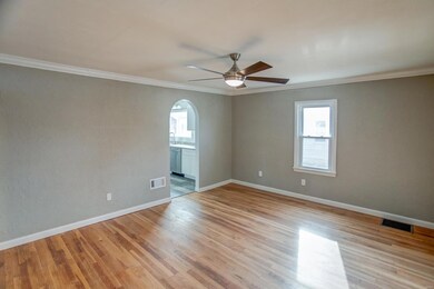 Original refinished hardwood floors, paint, and light fixtures throughout.