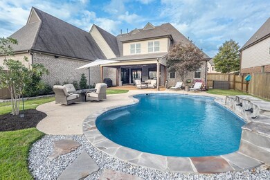 View of pool featuring a patio and an outdoor livi