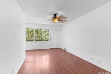 Living Room. Great light and treetop view. Enhance