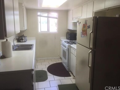 Unit Upstairs Kitchen Features Tile Floors
