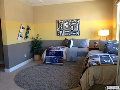 Secondary Bedroom  Photograph representation of li
