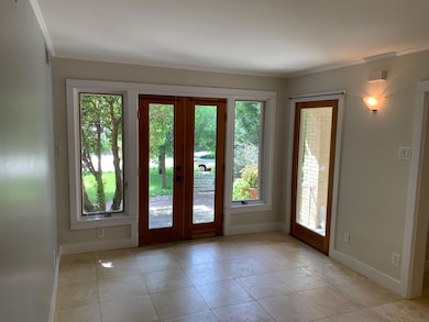 Doorway to outside with baseboards, ornamental mo