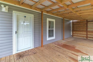 Front Door & Covered Porch with Privacy Wall.