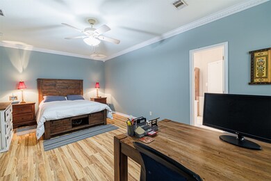 Generous primary bedroom with room for an office