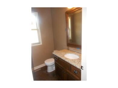Bathroom on main level includeds granite counter t