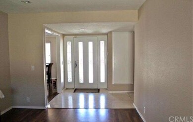 Front entry way tiled, leading into family room.