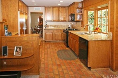 Kitchen has Recessed Lighting & Paver Tile Floorin