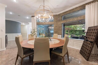 Formal Dining room featuring crown molding and deco chandelier