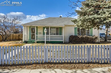 Ranch-style house with a fenced front yard, a porc