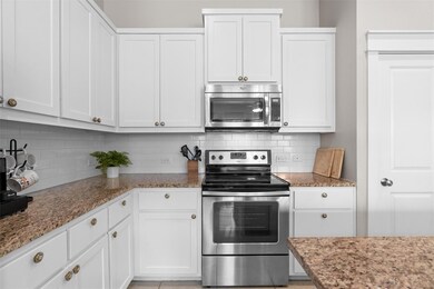 Kitchen with stainless steel appliances, tasteful