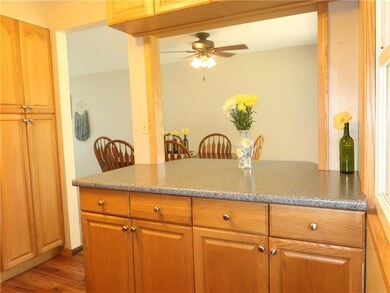 Kitchen with Large Open pass-through Island and Ha