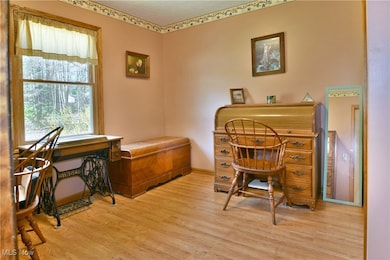 Office area with wood finished floors and baseboards
