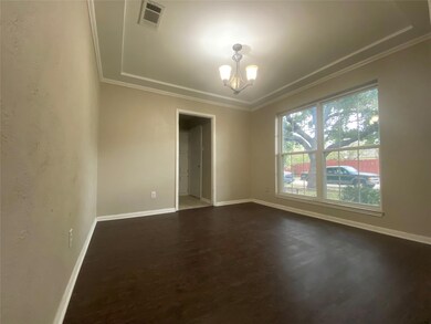 Dining/2nd living room with crown molding and a no
