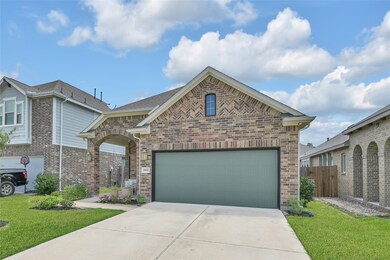 Single-story brick home featuring a two-car garage