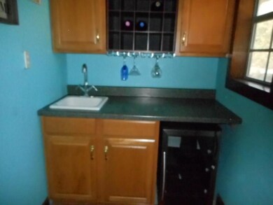 Wet bar in Family Room, the wine fridge stays!