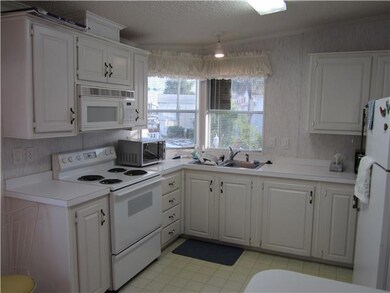 Kitchen. Another view--note double windows!