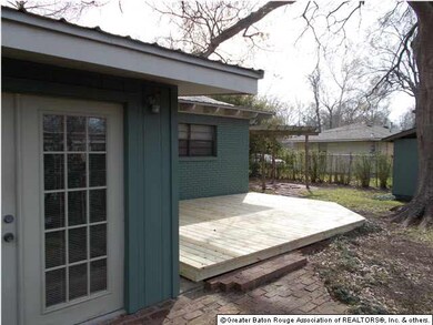 REAR DECK BY FRENCH DOORS OFF DEN