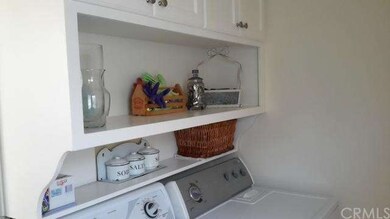 Indoor Laundry with custom cabinets. 
