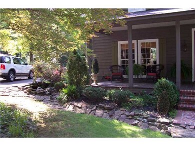 Rock bed across front of house