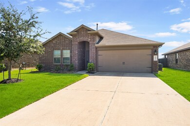 This charming brick home feels bright and airy, with an attached garage and double-wide driveway!