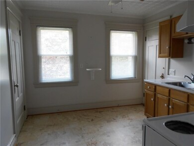 The eat-in kitchen has a pantry, door to the back 