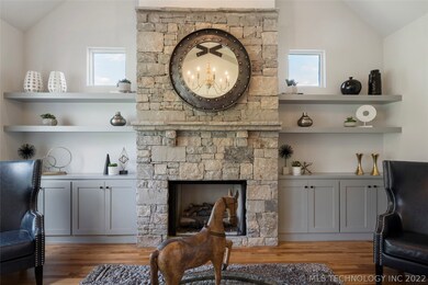 Dry stack stone fireplace with gas logs flanked by