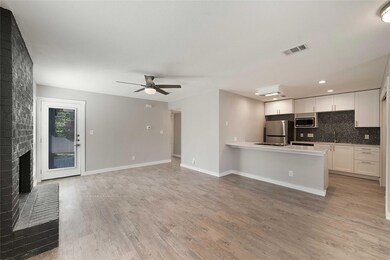 Kitchen with decorative backsplash, visible vents