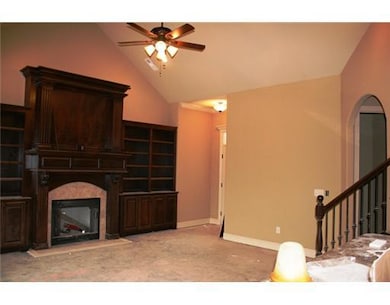 Den/Family/Great Room. Built-ins and fireplace with tile surround will be compliments by hardwood flooring.