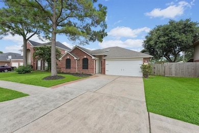 A well-maintained front yard, mature landscaping,