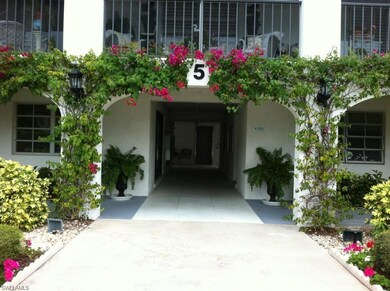 Property entrance featuring stucco siding
