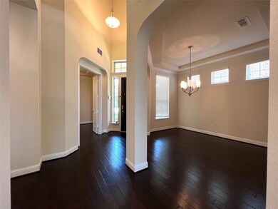 Overview of entrance showing formal dining and doors to study.