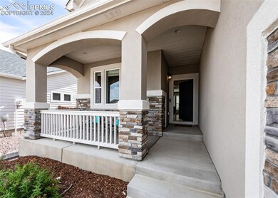 Entrance to property with a porch