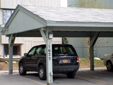Carport in front of condo