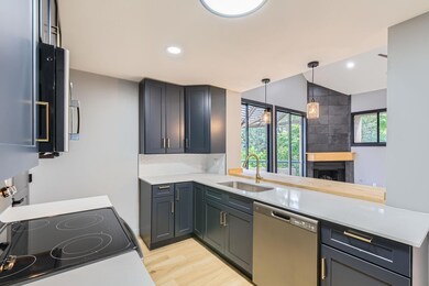 Kitchen featuring stainless steel appliances, a s