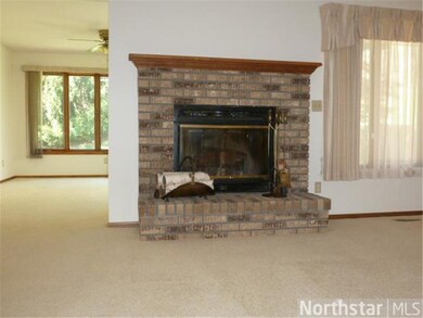 wood burning fireplace in living room.