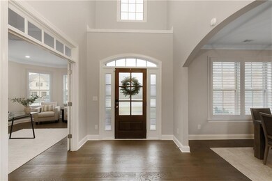 The open foyer is accented with elegant molding de