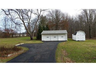 3 car garage with heater (possible workshop), stor