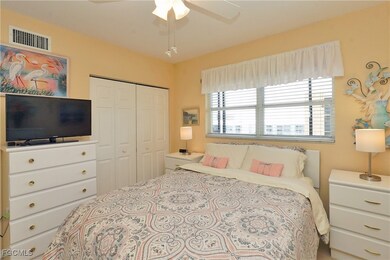 Bedroom with ceiling fan and a closet
