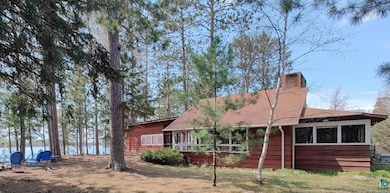 Rear view of property with a chimney
