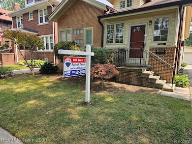 Exterior view of brick siding, a downspout, and gutters