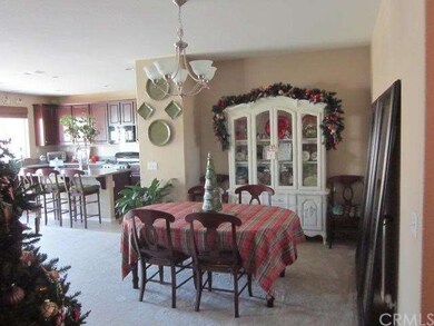 FORMAL LIVING ROOM/EATING AREA AND VIEW INTO THE G
