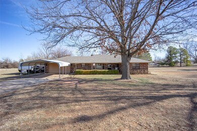 Ranch-style house featuring a carport