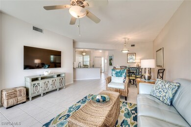 Living area with light tile patterned floors, base