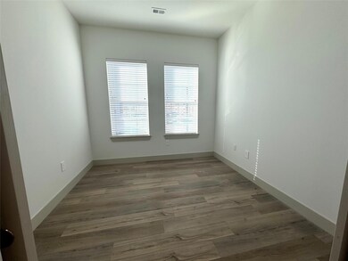 Unfurnished room with hardwood / wood-style floori