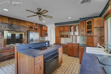 kitchen with island and fireplace