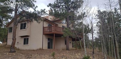 Side view of house with a large deck and walkout f