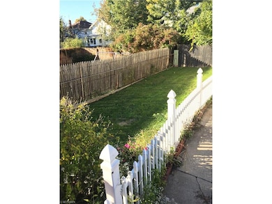 Great back yard with the little white fence!