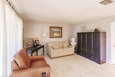 Living room featuring light hardwood / wood-style 