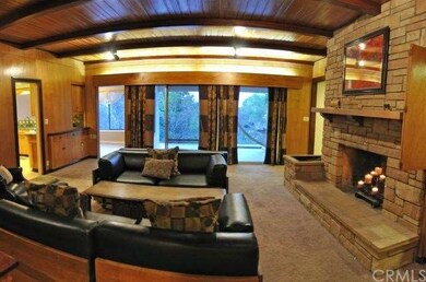 Family Room with Fireplace, wood beamed ceiling.